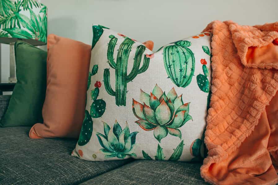 Orange, green, and white throw pillows.