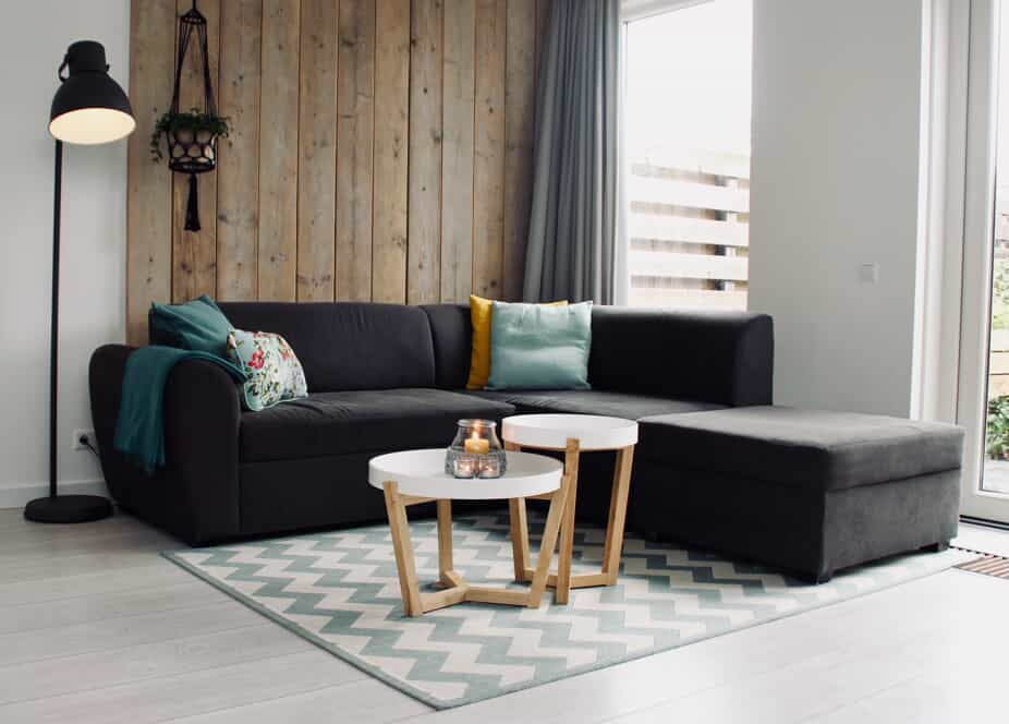 Living room with natural wood paneling.